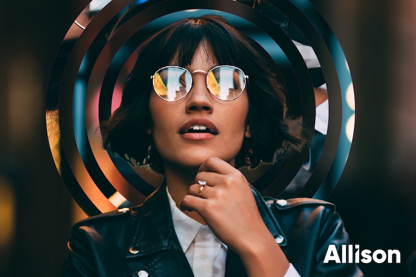 Woman wearing glasses with Allison agency logo superimposed