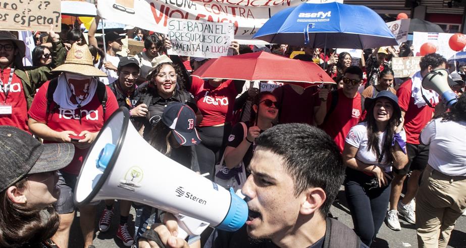 A man shouts slogans during a protest against the government proposed cuts to public education in San Jose, Costa Rica August
