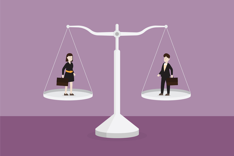 Businessman and businesswoman on the scale