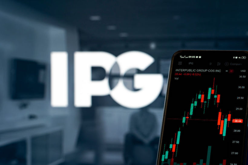 Smart phone displaying IPG stock