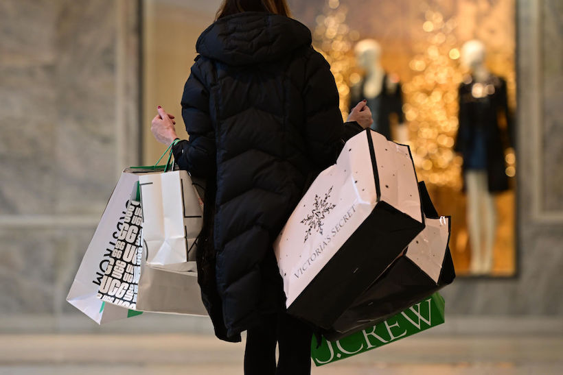 Woman holding holiday shopping bags