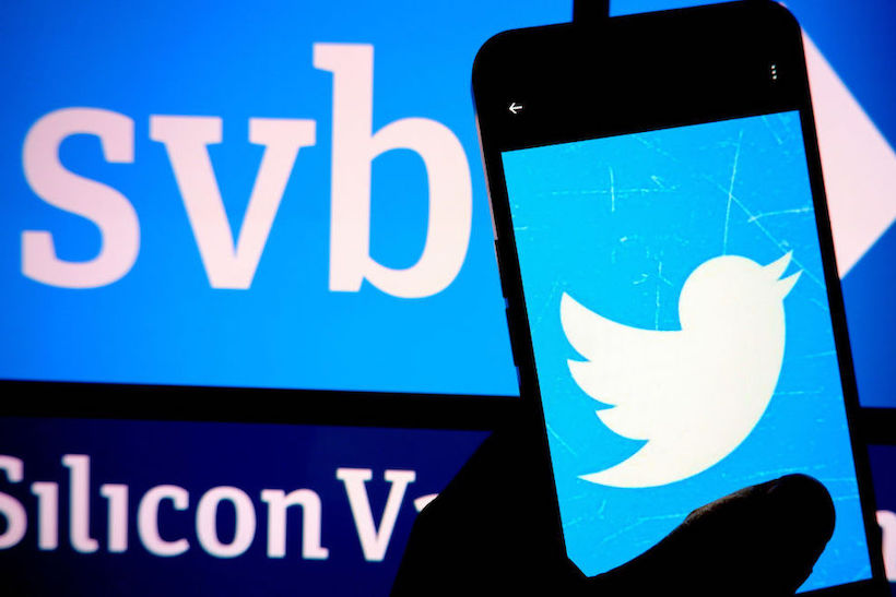 Twitter logo displayed on a smartphone with Silicon Valley Bank logo in background