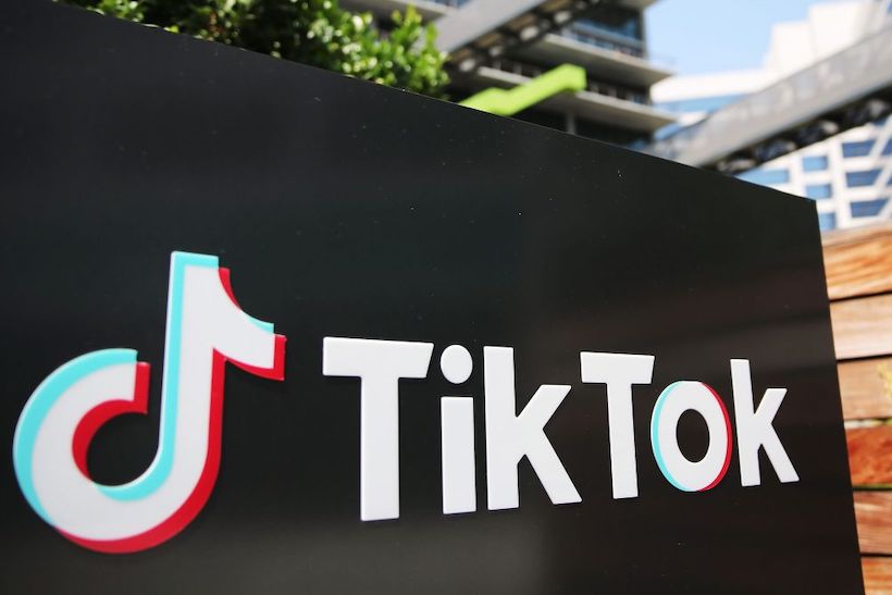 TikTok logo sign outside office building