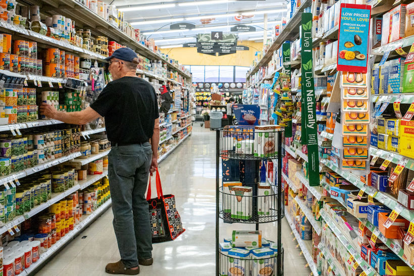 A customer shops in a Kroger grocery store 