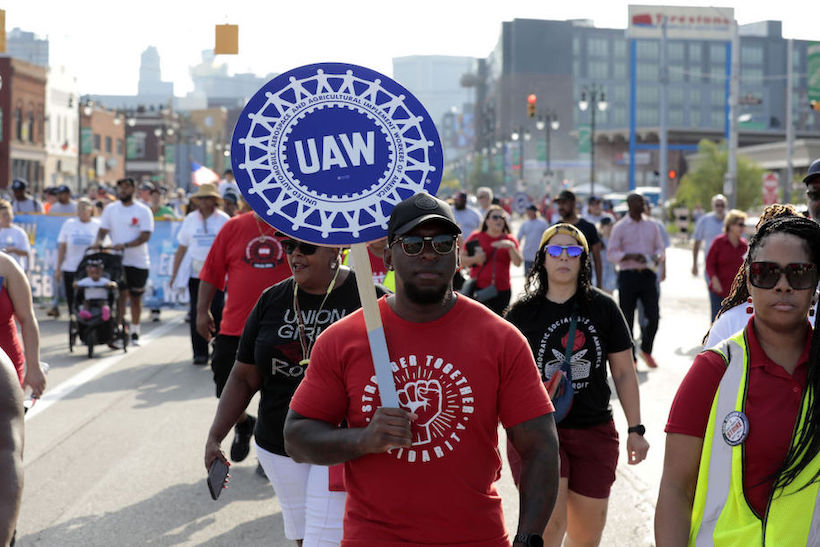 United Auto Workers (UAW) members and supporters march during a Labor Day parade in Detroit