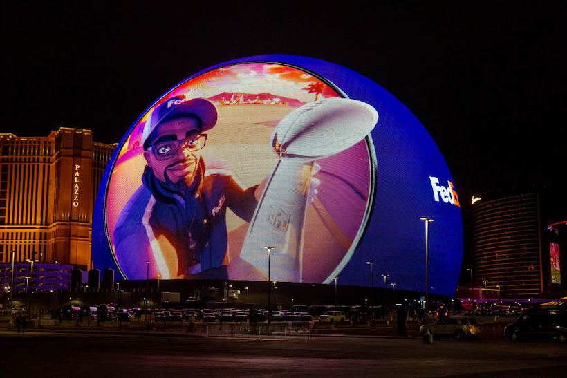 The Sphere displays advertising featuring a FedEx driver delivering the Vince Lombardi Trophy leading up to Super Bowl LVIII
