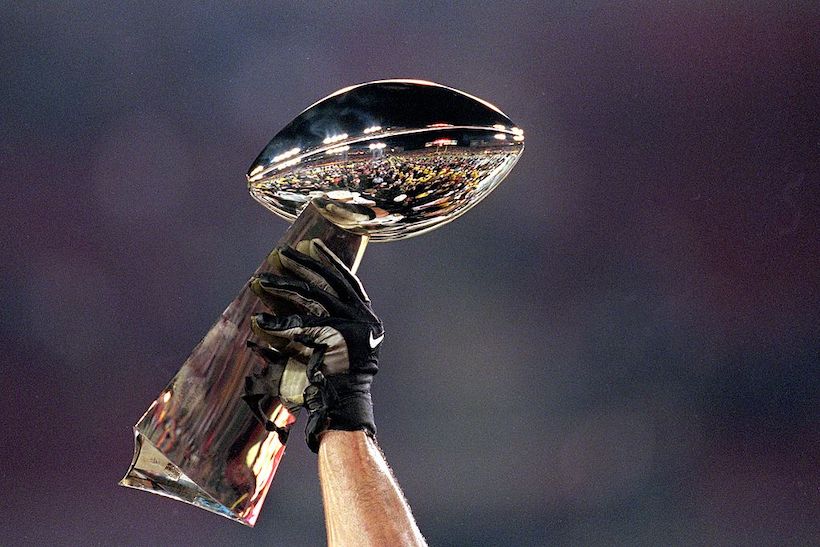 A general view of the Lombardi Trophy being held aloft before Super Bowl XXXV