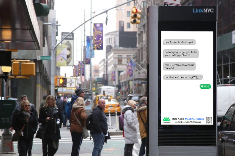 Billboard displaying Android ad showing text chats with gray and green text bubbles