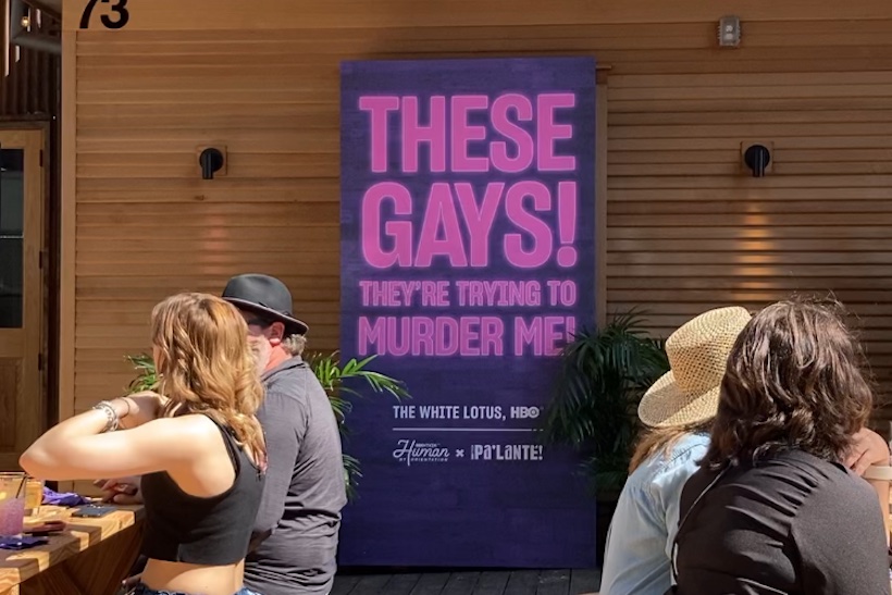 Poster at SXSW reading "These gays! They're trying to murder me!"