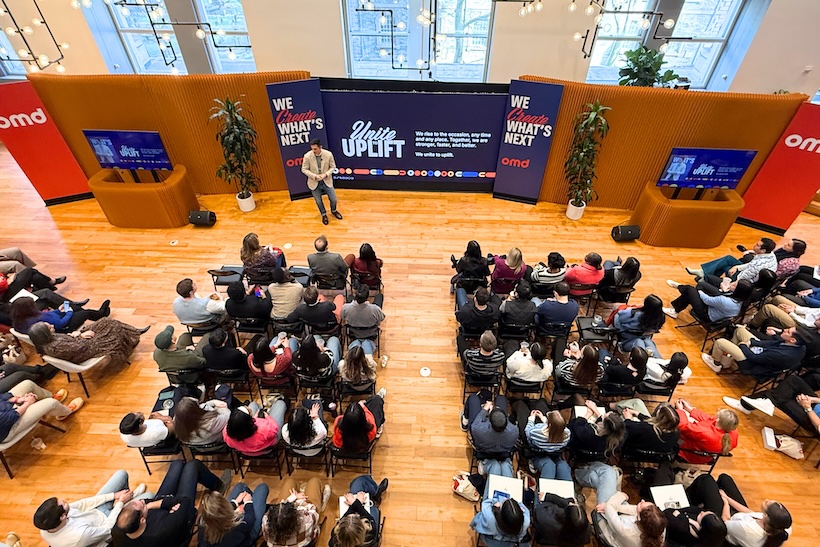 Group of people attend the OMD Unite Uplift event