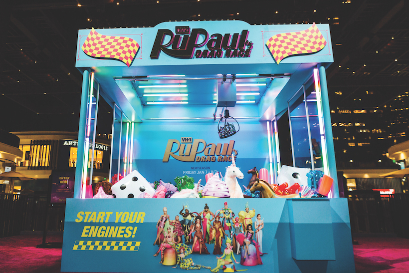Claw machine branded with RuPaul's Drag Race logo