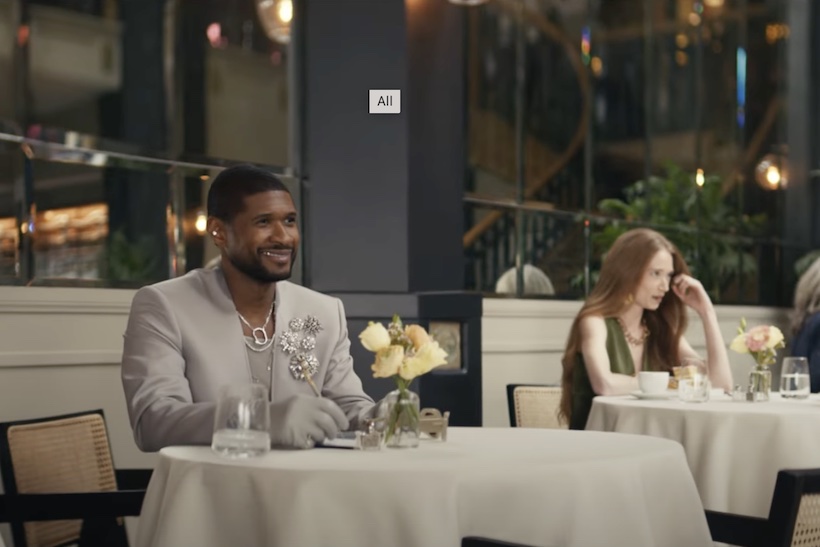 Usher sitting at table