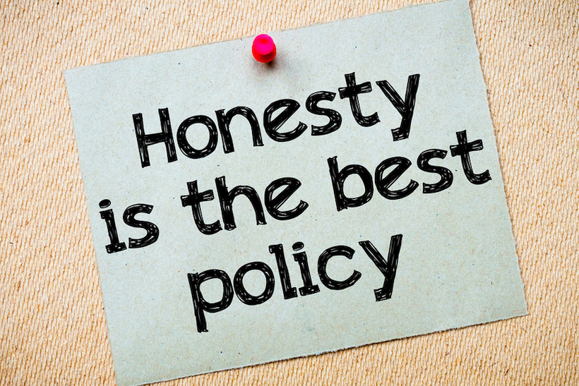 Note pinned to wall reading "Honesty is the best policy"