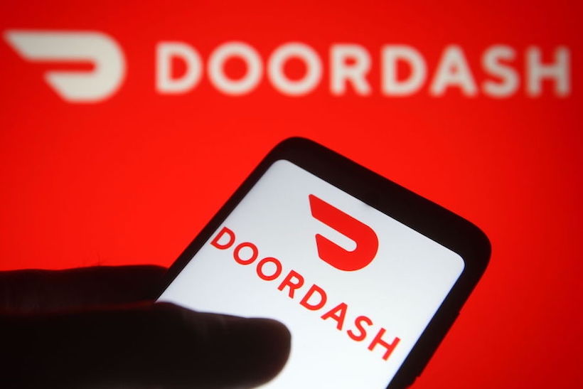Smart phone displaying DoorDash logo