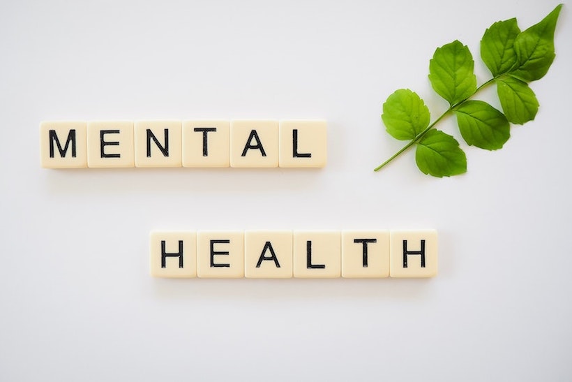 Scrabble pieces spelling out "mental health"