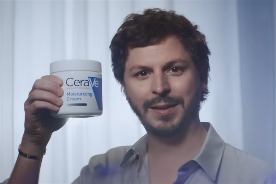 Michael Cera holds a tub of CeraVe cream