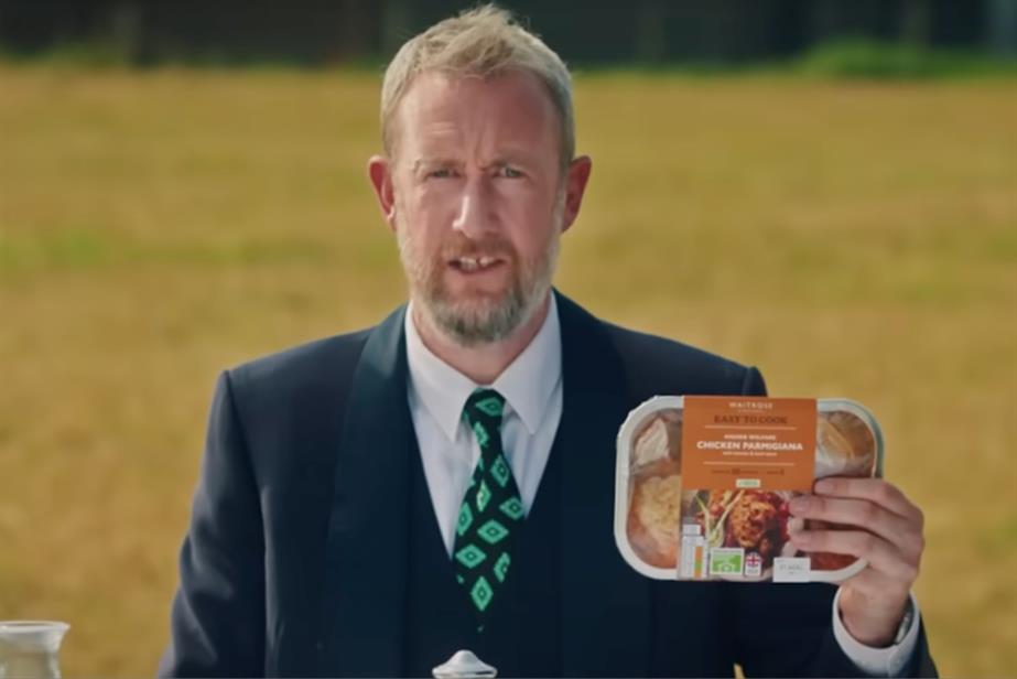 Alex Horne holding a pack of Waitrose chicken