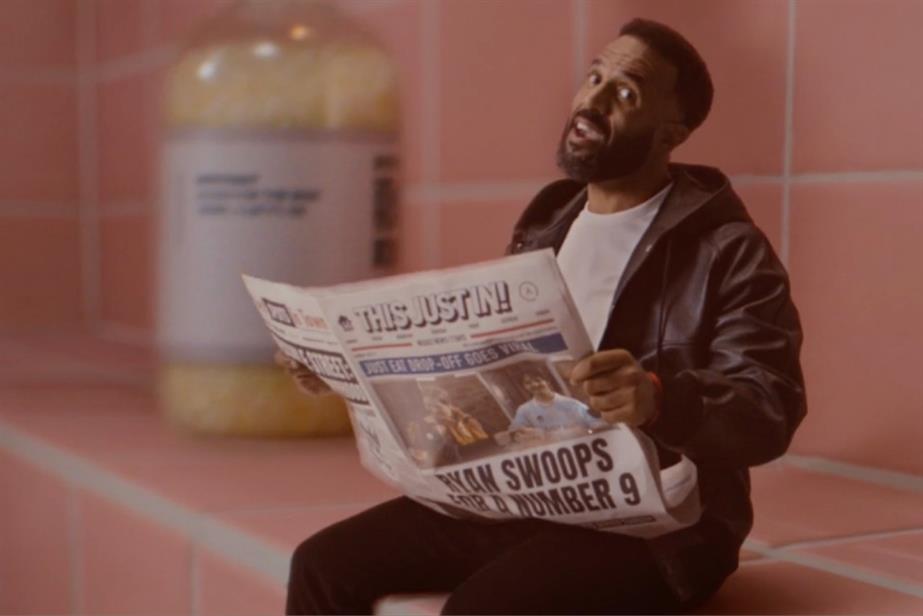 Craig David reading a newspaper