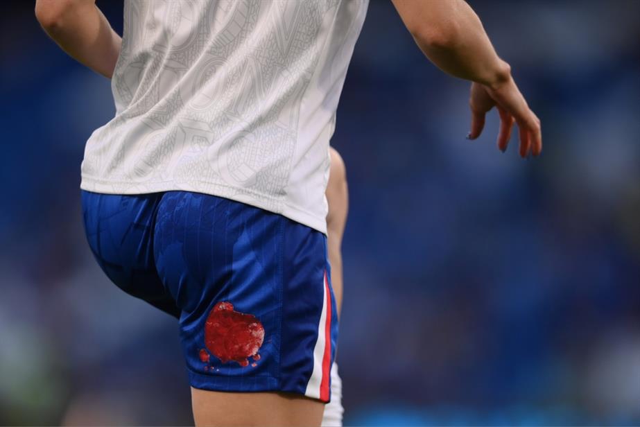 Period stained football shorts
