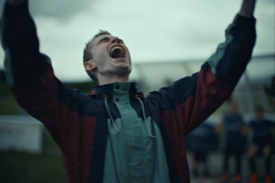 Man with his arms up in the air screaming