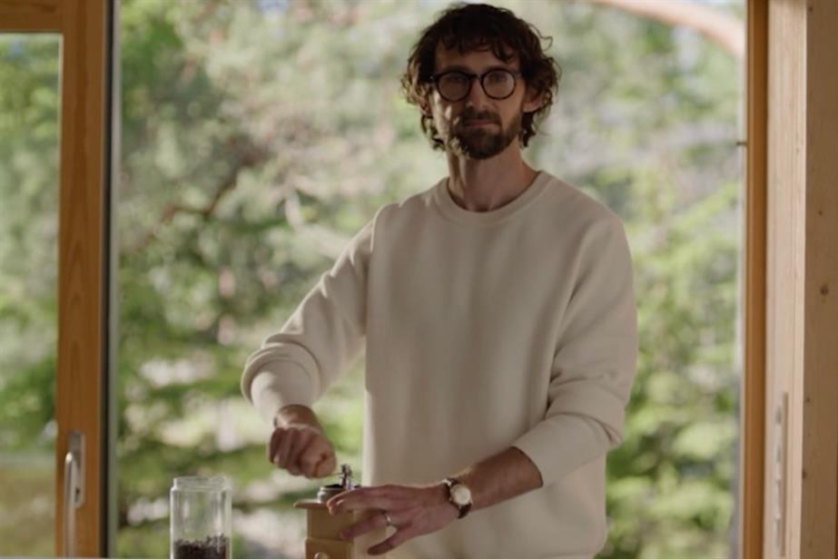 Man grinding coffee beans