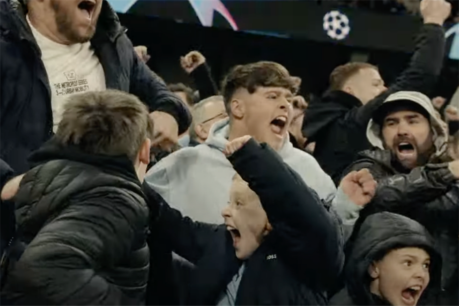 A group of football fans exulting for a goal