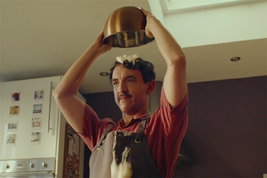 a man with whipped cream on his head 