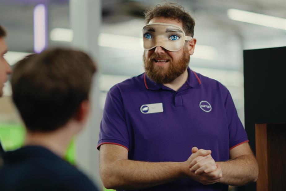 Currys employee wearing an eye mask