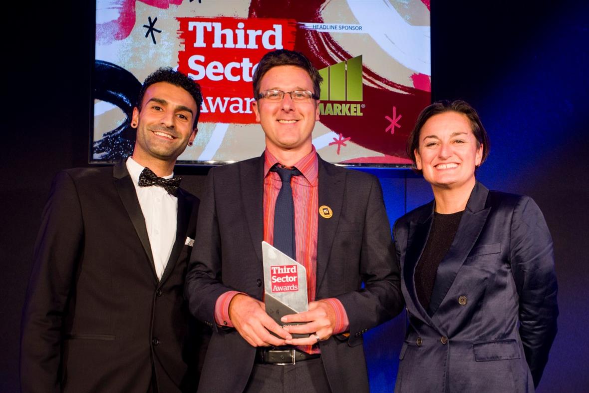 Stephen Hale collects his award from host Zoe Lyons (right) and Eddy Lee from Third Sector Jobs
