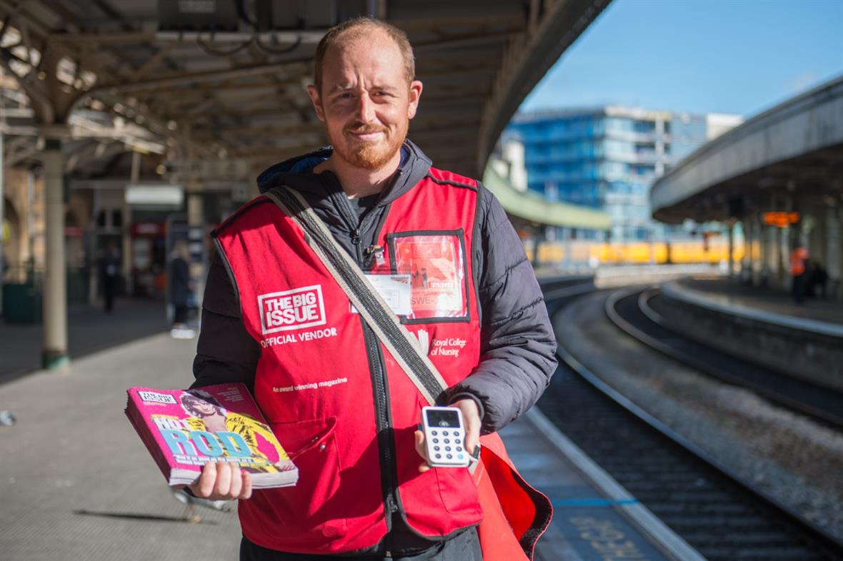 Big Issue vendor Mike Hall with his contactless card machine