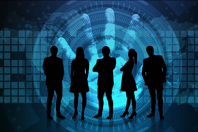 Business people silhouettes standing in a depiction of cyber space with a hand in the background depciting a cyber security breach