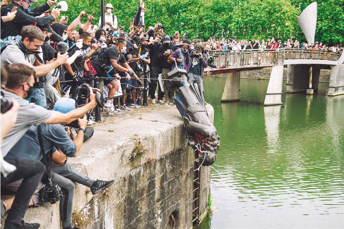 Black Lives Matter protesters throw the statue of philanthropist and slave trader Edward Colston into the Avon in June 2020. Photo by Giulia Spadafora/NurPhoto via Getty Images 