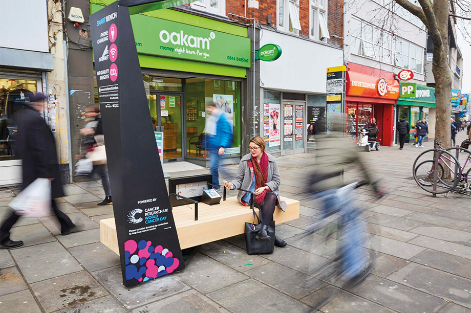 Cancer Research UK's contactless donation bench in use