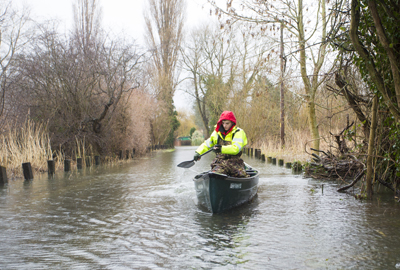 Volunteer James Wilson uses his canoe to transport supplies to residents