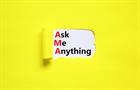 Torn paper revealing the words "Ask Me Anything"