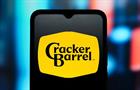 The redesigned Cracker Barrel Old Country Store logo is seen displayed on a smartphone screen