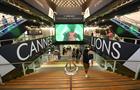 People walking past Cannes Lions signage