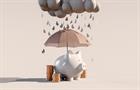 Piggybank holding umbrella