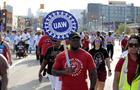 United Auto Workers (UAW) members and supporters march during a Labor Day parade in Detroit