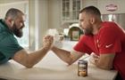 Travis and Jason Kelce arm wrestling over can of Campbell’s Chunky soup