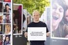 Made in Chelsea star Jamie Laing, standing between rows of photos of people who took their own lives, holding a sign saying '61% of people would struggle to tell if someone they knew felt suicidal'
