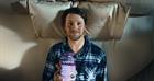 Bills quarterback Josh Allen lies in bed holding a bottle of Natrol