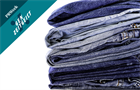 Pile of stacked blue jeans
