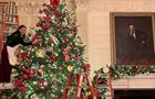 Woman hanging ornaments on Christmas tree in the White House