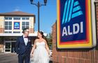 Bride and groom outside Aldi