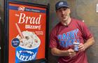 Brad Marchand standing next to Dairy Queen ad for The Brad Blizzard