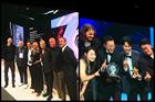 Two groups of people from The Monkeys and Cheil Worldwide receiving awards on stage at Cannes Lions