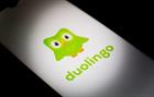 Stock art of the Duolingo logo on a smartphone screen