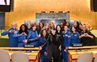 A group of female astronauts pose at the U.N.’s General Assembly Hall