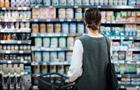 Woman shopping for baby formula at grocery store